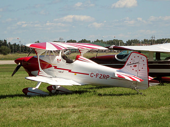 Airplane at the air show in Alberta 14, blue, white, grass, Airfields, green, airplane, red, clouds, sky HD wallpaper