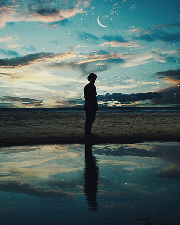 A solitary figure silhouetted against a twilight beach scene with stars and reflection. HD phone wallpaper