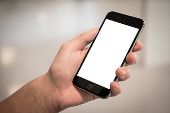 A hand holding a modern smart with a blank screen, ideal for design mockups. HD wallpaper