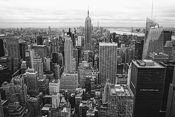 Classic black and white view of New York City's skyline featuring skyscrapers and urban architecture. HD wallpaper