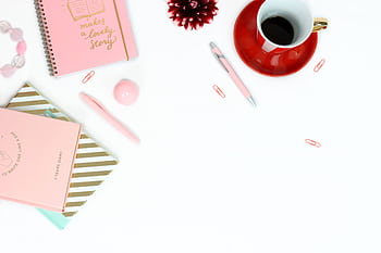 Elegant pink stationery and coffee setup for a creative work session. HD wallpaper