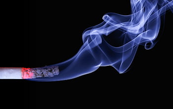 Detailed close-up of a cigarette with glowing ember and swirling smoke on a black background. HD wallpaper