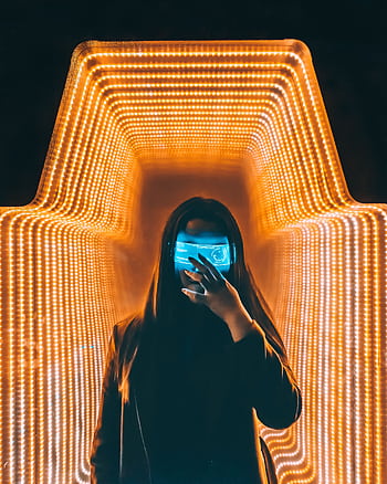 Asian woman in a cyberpunk setting with neon lights wearing a LED mask, creating a futuristic and moody vibe. HD phone wallpaper