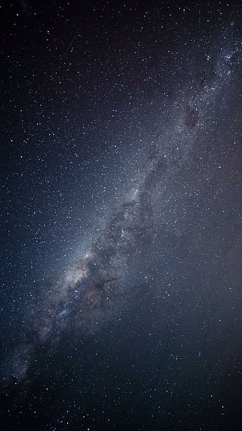 Stunning vertical shot of the Milky Way galaxy illuminating the night sky. HD phone wallpaper