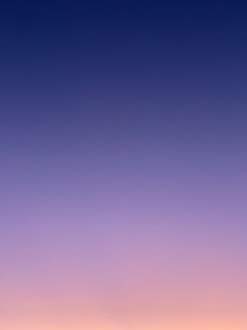A stunning twilight sky showcasing a gradient of vivid colors transitioning from pink to blue. HD phone wallpaper