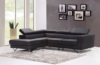 Contemporary living room featuring a sleek black sectional sofa and chic wall art. HD wallpaper
