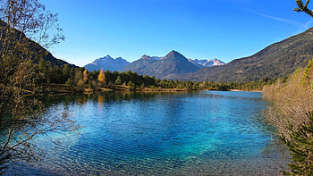 Crystal clear water lake in the alps - Tyrol, trees, sky, mountains, reflections, austria HD wallpaper