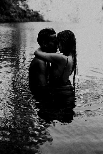 A couple tenderly hugging in a serene lagoon during the day. Black and white graphy enhances the intimacy. HD phone wallpaper