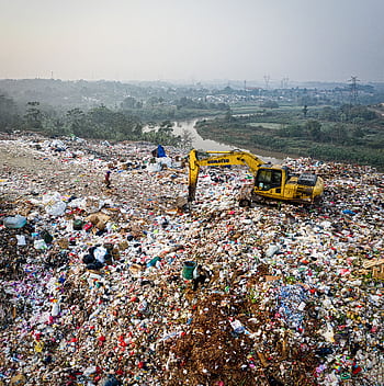 Aerial shot of a sprawling landfill in South Tangerang, Indonesia, highlighting waste and pollution challenges. HD phone wallpaper