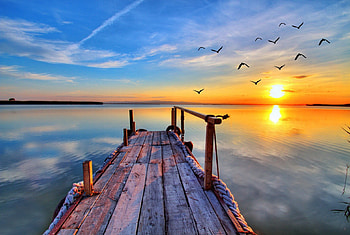 Sunset, rays, birds, crystal, glow, pier, nice, reflection, dock, sun, sundown, beautiful, pretty, clouds, nature, sky, clear, lovely HD wallpaper