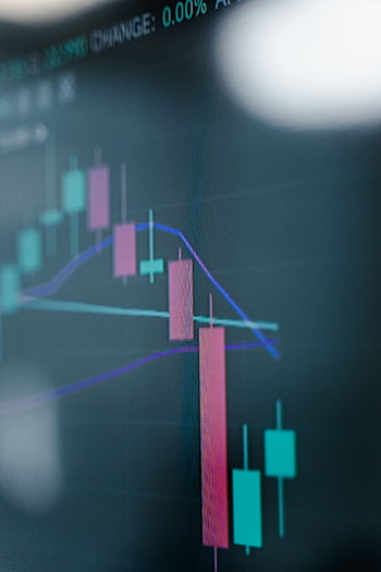Close-up of a digital stock market chart showcasing analytics on a screen. HD phone wallpaper