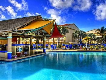 Hotel Pool, blue, hotel, beautiful, chairs, clouds, trees, nature, pool, sky, water HD wallpaper