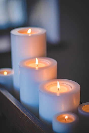 A close-up of a serene candlelight arrangement with a soft, soothing glow. HD phone wallpaper