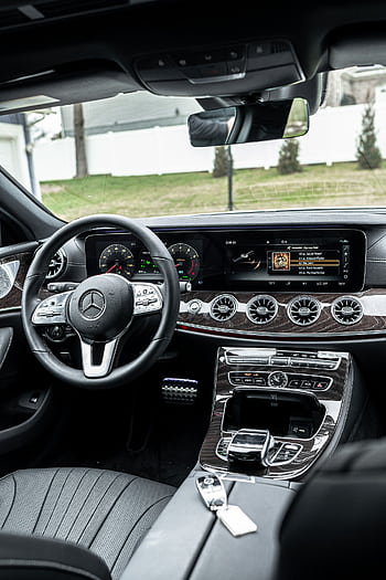 Explore the sophisticated interior of a Mercedes Benz with modern technology and luxury finishes. HD phone wallpaper