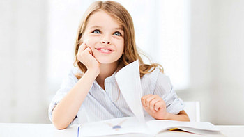 Smiling Grey Eyes Cute Little Girl With Book Is Wearing White Shirt Sitting In Blur White Background Cute HD wallpaper