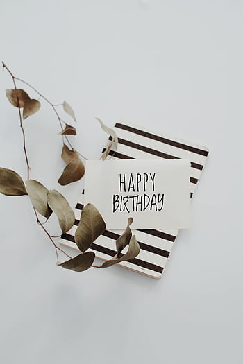 A minimalist birtay greeting card with dried eucalyptus leaves on a striped background. HD phone wallpaper