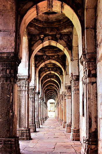 A stunning view of ancient stone arches in a historic Indian architectural landmark. HD phone wallpaper