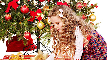 Cute Little Girl Is Sitting In Decorated Christmas Tree Background Wearing Red White Dress And Bowknot Clips On Head Cute HD wallpaper