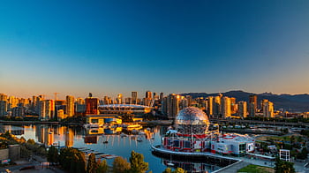 Vibrant sunset view of Vancouver's skyline, featuring Science World and cityscape reflections. HD wallpaper