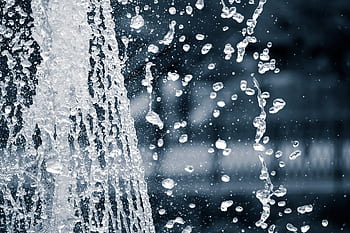 Captivating black and white of splashing water droplets in motion. HD wallpaper