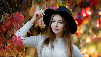 Blue Eyes Stunning Beauty Girl Model Is Wearing White Dress And Black Hat Standing In Colorful Blur Bokeh Background Girls HD wallpaper