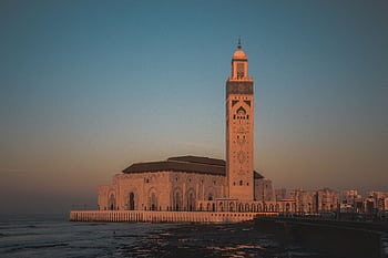 Stunning view of Hassan II Mosque against the sunset sky in Casablanca, Morocco. HD wallpaper