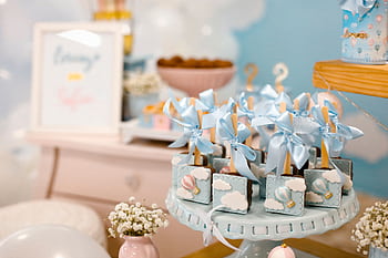 Elegant baby shower dessert table with pastel decorations and sweet treats. HD wallpaper