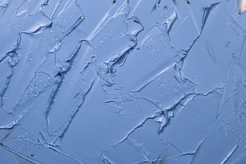 Textured blue paint background showcasing abstract patterns and artistic expression. HD wallpaper
