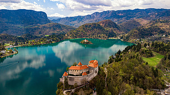 Bled Castle, Lake Bled, Slovenia, water, reflections, landscape, clouds, building, sky, mountains HD wallpaper