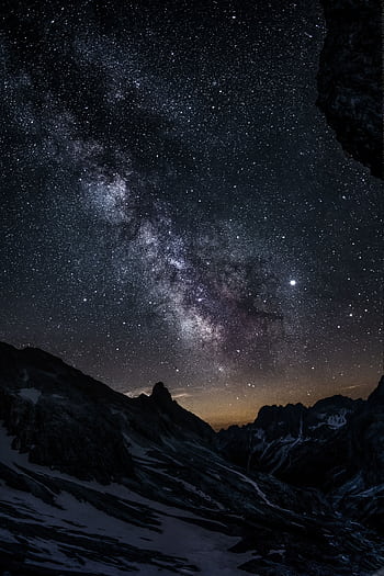 Breathtaking view of the Milky Way galaxy over the mountain peaks in Vigo di Fassa, Italy. HD phone wallpaper