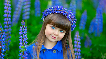 Blue Eyes Cute Little Girl Is Standing In Blue White Lupine Flowers Field Background Wearing Blue Dress And Wreath Cute HD wallpaper