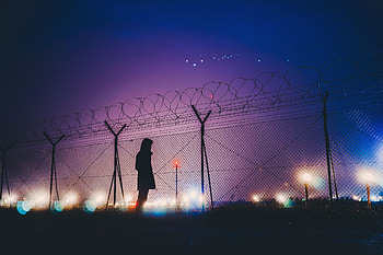 Night Lights Person Standing Behind Fence Silhouetee, person, alone, silhouette, graphy HD wallpaper
