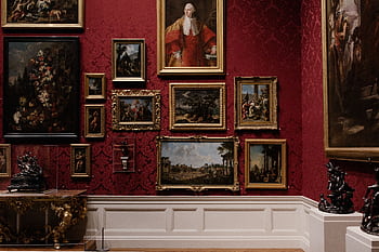 Discover classic art in an elegantly designed gallery space with red ornate walls. HD wallpaper