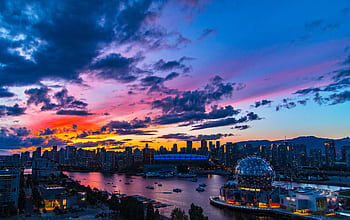 Dramatic sunset over Vancouver skyline featuring Science World and vibrant clouds. HD wallpaper