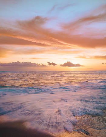 Experience a stunning Hawaiian sunset with vibrant colors and gentle waves at the beach. HD phone wallpaper