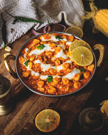 A mouth-watering Indian curry with lemon slices, perfect for food lovers. HD phone wallpaper