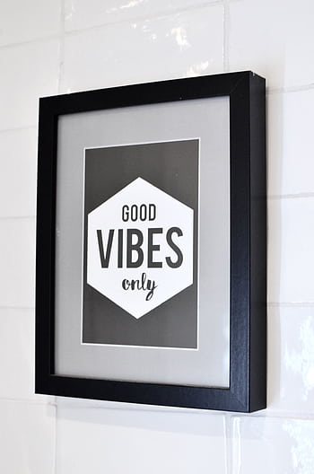 Modern framed art piece with 'Good Vibes Only' quote in a minimalist design. HD phone wallpaper