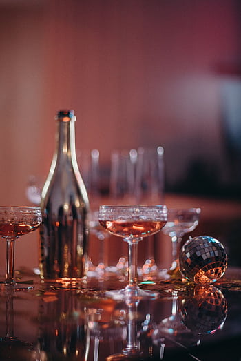 A luxurious champagne setup with a disco ball for a festive celebration. HD phone wallpaper