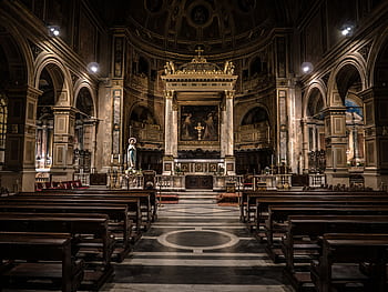 Interior view of a Gothic-style basilica in Rome, showcasing intricate architecture and religious art. HD wallpaper
