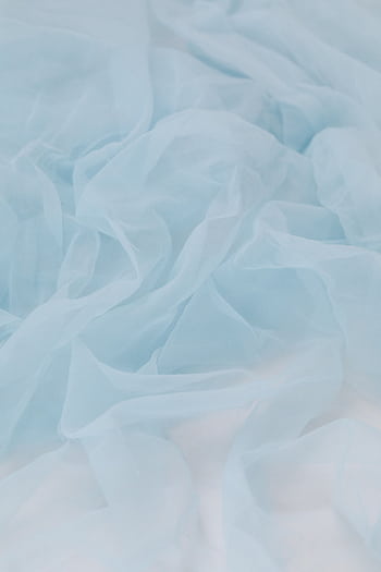 Soft pastel blue silk fabric creating an elegant and smooth texture, perfect for backgrounds or themes of softness and luxury. HD phone wallpaper