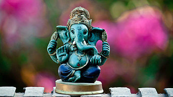 Cute Blue Ganesh Statue In Colorful Blur Background Cute HD wallpaper