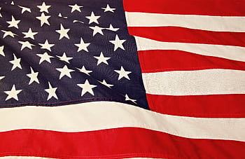 Detailed of the American flag showcasing the stars and stripes symbolizing USA's patriotism and pride. HD wallpaper