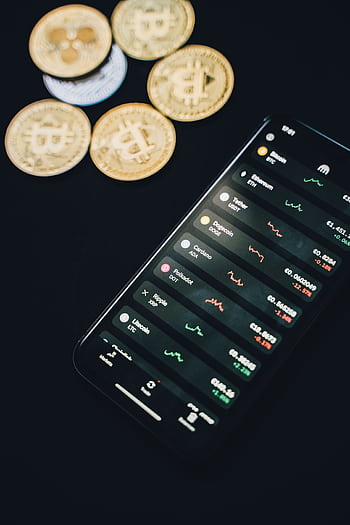 Smart showing cryptocurrency exchange app with bitcoin coins in the background, conveying digital finance. HD phone wallpaper