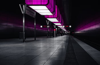 A modern and vibrant subway station in Hamburg, Germany, featuring pink neon lighting. HD wallpaper