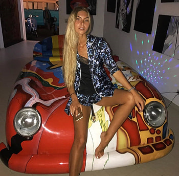 ANJELICA EBBI, BLUE AND WITE JACKET AND MATCHING SHORTS, JEWELRY, SITTING ON FRONT PIECE OF A PORSHE, BLACK LACE TOP HD wallpaper