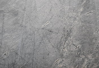Close-up of a textured grey stone surface suitable for backgrounds or . HD wallpaper