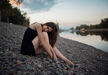 Girl Sitting Rocks Looking At Viewer , girls, model, rocks, black-dress HD wallpaper