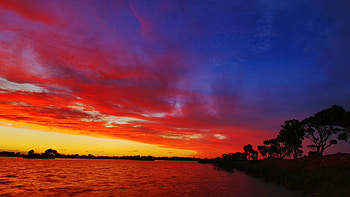 Fiery sunset at Wellington, Victoria, australia, clouds, colors, trees, sky, water, lake HD wallpaper