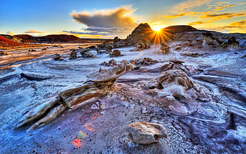 Sun rays over the rocks, rays, glow, sunrise, nice, shore, waves, amazing, ocean, sunset, sea, sundown, dazzling, beautiful, rocks, stones, summer, clouds, nature, sky, lovely HD wallpaper
