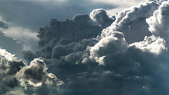 Captivating cumulus clouds forming a dramatic and textured sky, perfect for backgrounds. HD wallpaper